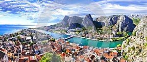 Travel in Croatia - Omis town surrounded by mountains photo