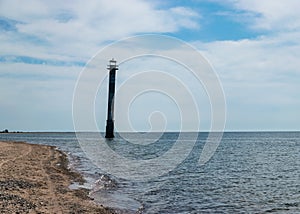 Landscape with an abandoned sloping lighthouse