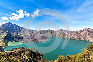 Landscape of active volcano Baru Jari, Lake Segara Anak and summit of Rinjani mountain. Lombok island, Indonesia