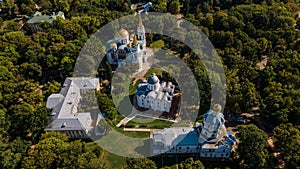 Landscape aerial shot of ancient historical Chernihiv town with churches, trees, river, roads, buildings