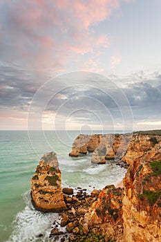 Landscape on the Algarve coast at sunset. Beach in southern Portugal the best travel destination for tourists on vacation. seascap