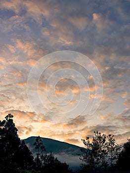 Landscape with altocumulos clouds at sunrise photo