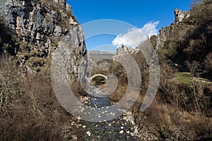 Landscape of Ancient Bridge of Kontodimos or Lazaridis in Vikos gorge and Pindus Mountains, Zagori, Epirus, Greece