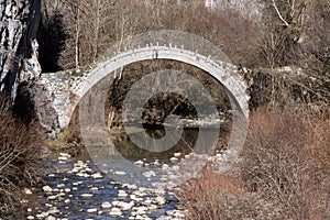 Landscape of Ancient Bridge of Kontodimos or Lazaridis in Vikos gorge and Pindus Mountains, Zagori, Epirus, Greece