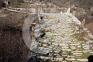 Landscape of Ancient Bridge of Missios in Vikos gorge and Pindus Mountains, Zagori, Epirus, Greece