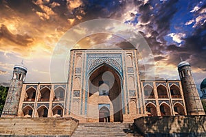 landscape with ancient Islamic Kukeldash madrasah in Tashkent in Uzbekistan. Old madrasa in Asia at sunset beautiful sky
