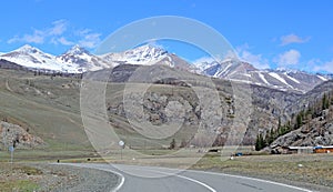 Landscape with an automobile road in the background of the Altai