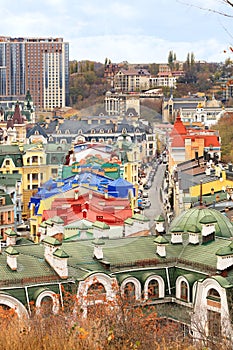 Landscape of an autumn city with a view of the restored roofs and buildings of Vozdvizhenka, the old district of Podil in the city