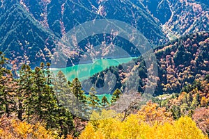 Landscape of autumn forest and blue lake, Tateyama Japan Alps