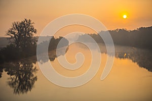 Landscape in the fall season near river photo