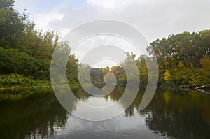 Landscape of an autumn river in cloudy weather