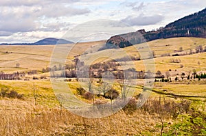 Landscape with autumnal meadows and hills