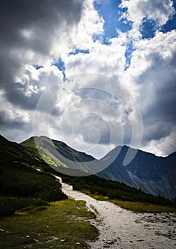 The dramatic sky above the mountain ridge