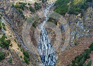 Landscape of the Balea waterfall in the Fagaras mountains in late autumn