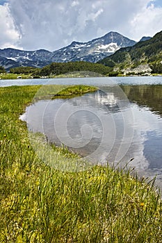 Landscape of Banderishki chukar peak and Reflection in Muratovo lake, Pirin Mountain