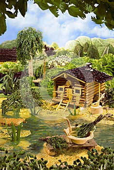 Landscape with bathhouse made from food photo