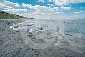 Landscape of the beach on the lake with therapeutic silt mud
