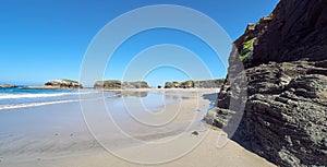 Landscape of a beach with rocky cliffs in Galicia