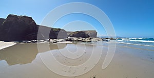 Landscape of a beach with rocky cliffs in Galicia