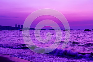 Landscape beach and sea and purple sky at the sunset