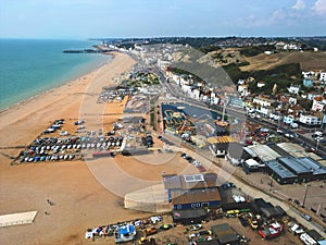 Landscape of a beach surrounded by buildings in Hasting, the UK
