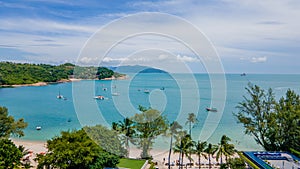 Landscape with beautiful tropical beach and palm trees near ocean. Thailand Asia. Drone.