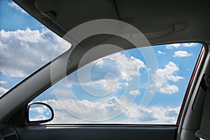 Landscape behind car window