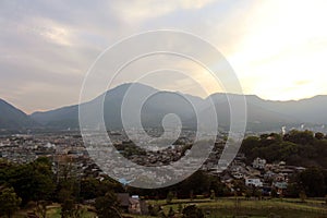 The landscape of Beppu in Oita and golf range as seen from a hill in sunset