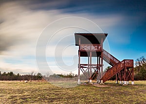 Landscape with big watching tower. Long exposure photo.