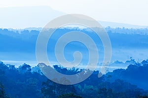 Landscape of blue mountain in the morning mist