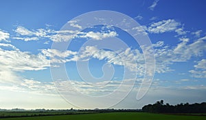 Landscape, blue sky, green fields, early morning concept. Use to design backgrounds and wallpapers