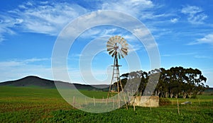 Landscape with Windmill waterpump photo