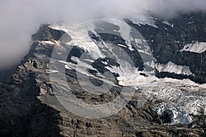 Landscape with Bluemlisalp mountain between Oeschinen mountain station and Oeschinensee lake.