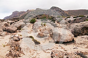 Landscape with boulders, weathered stones, sandstones, rocks and mountains