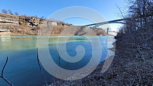 Landscape of the bridge over a river on the background of Niagara Falls