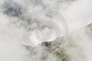 Landscape from Bucegi Mountains, part of Southern Carpathians in Romania in a foggy day