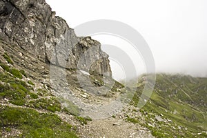 Landscape from Bucegi Mountains, part of Southern Carpathians in Romania in a foggy day