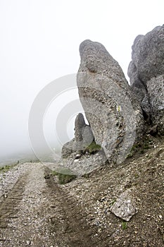 Landscape from Bucegi Mountains, part of Southern Carpathians in Romania in a foggy day