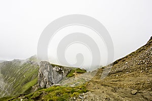 Landscape from Bucegi Mountains, part of Southern Carpathians in Romania in a foggy day