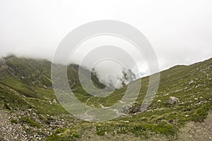 Landscape from Bucegi Mountains, part of Southern Carpathians in Romania in a foggy day