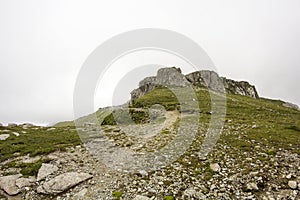 Landscape from Bucegi Mountains, part of Southern Carpathians in Romania in a foggy day