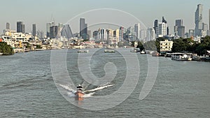 Landscape of buildings river and boats in Thailand