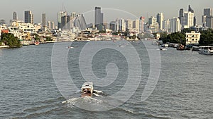 Landscape of buildings river and boats in Thailand