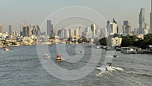 Landscape of buildings river and boats in Thailand