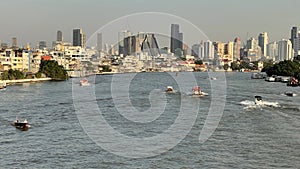 Landscape of buildings river and boats in Thailand