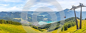 Landscape with cable car, lake Wolfgangsee and mountain Schafberg, view from the mountain Zwolferhorn