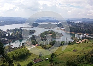 Landscape with calm lakes, green mountains, lush forests and some summer villas