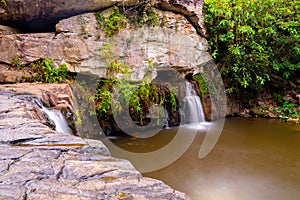 Landscape of calm water flowing through the rock/stone