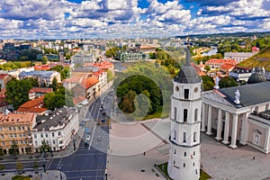 Landscape of the Cathedral Square surrounded by buildings under a cloudy sky in Vilnius, Lithuania