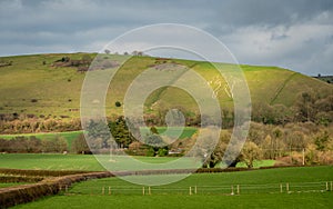 Landscape of Cerne Abbas in Dorset with ancient Cerne Abbas Giant hill figure